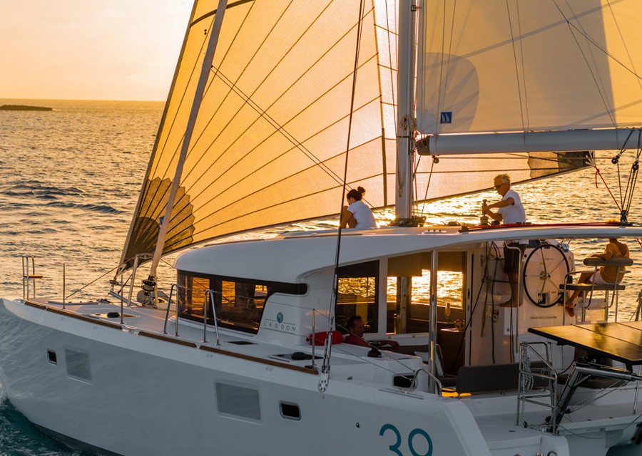 Sail off into the sunset on your catamaran charter with Boatbookings.com