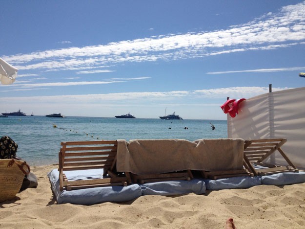 Kick back with your feet in the sand at Club 55 St Tropez