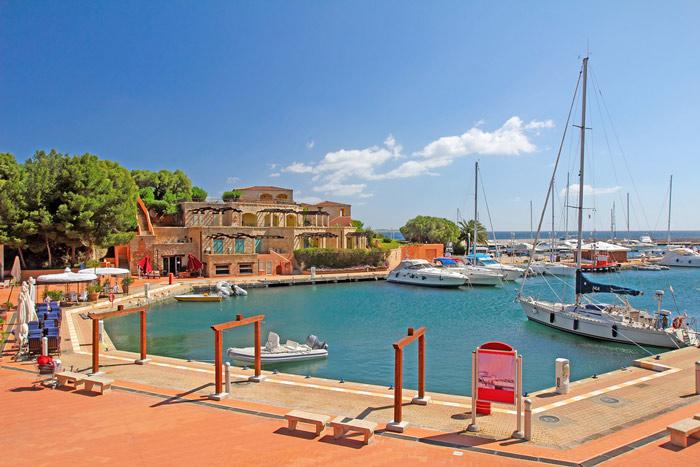Berthed yachts in the pretty port of Portisco