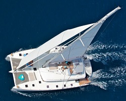 NOVA is a modern white sailing catamaran with a spacious interior and large flybridge.
