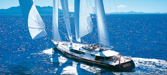Gorgeous dark-hulled super sailing yacht, performing superbly under full sail