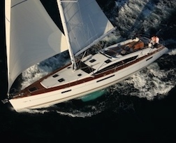 Sleek and spacious Jeanneau sailing yacht under performance sail