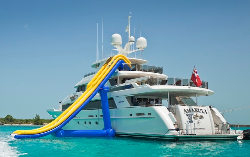 Inflatable water slides on yachts provide endless fun.